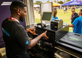 One World Rental staff handling EPOS and cash drawers at Albert Park F1 event